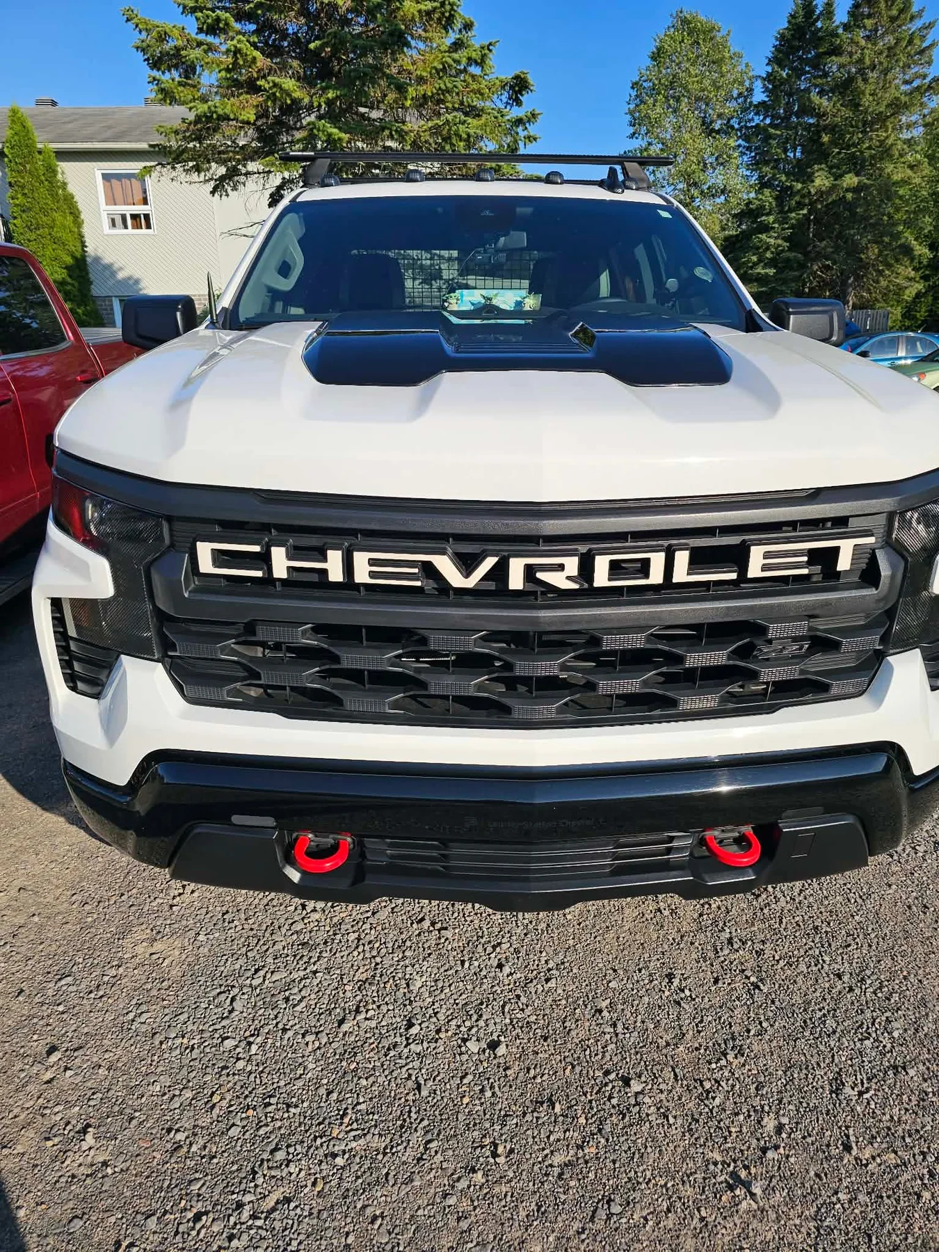 A customer’s freshly detailed white Chevrolet truck