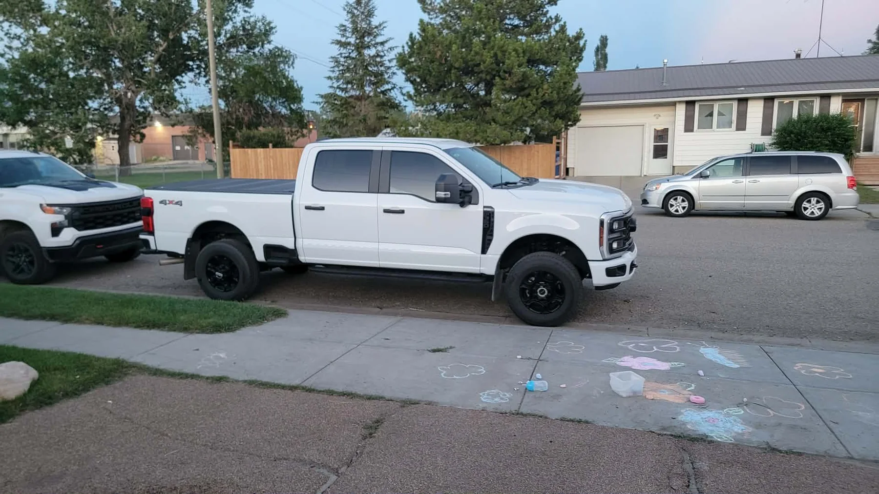A customer’s polished white pickup in natural light