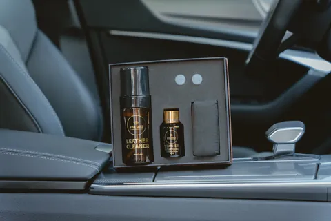 A Magic Shield leather coating presentation box resting inside a vehicle.