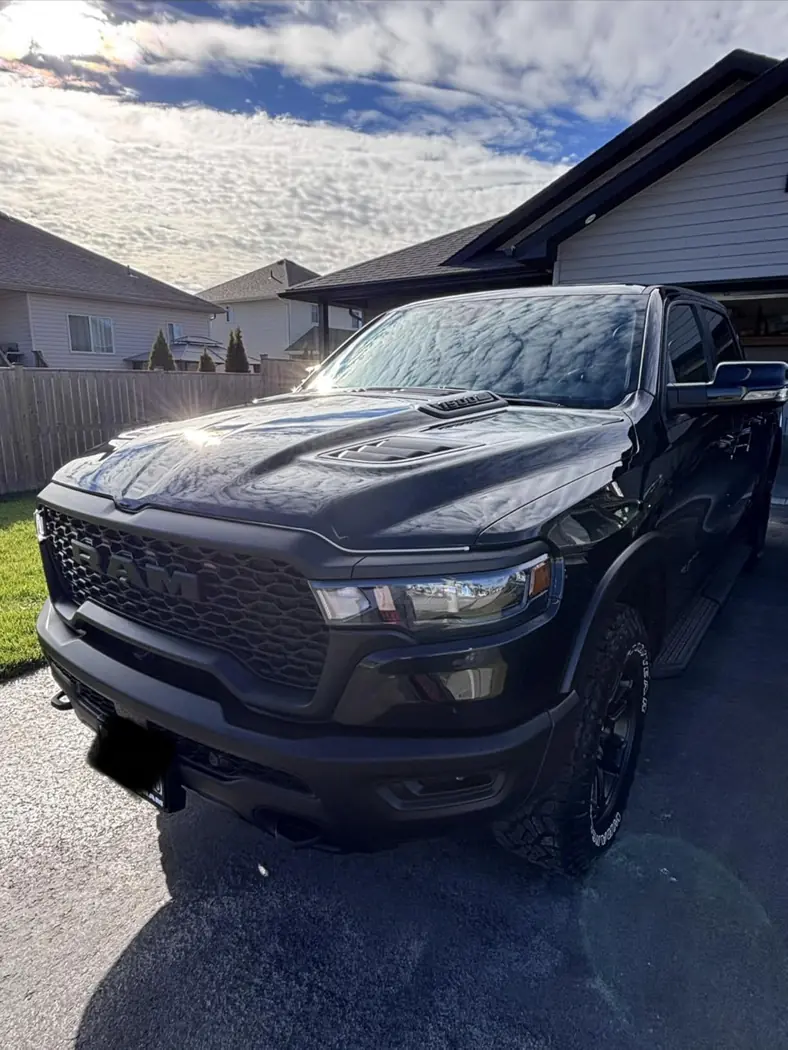 Amazon customer black pickup truck with strong paint reflections