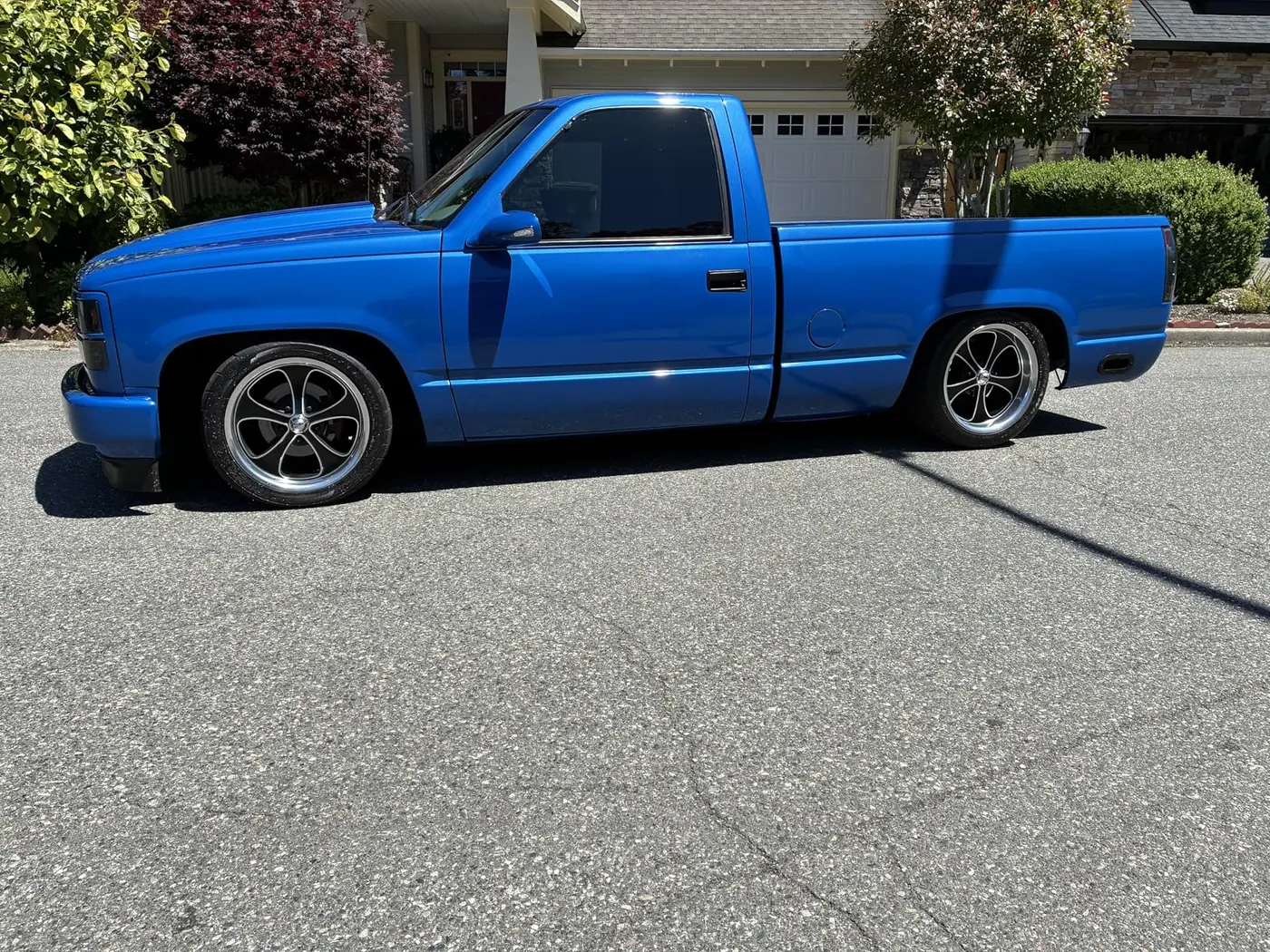 Amazon customer blue pickup truck with bright paint reflections